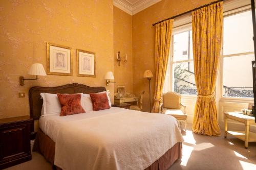 a bedroom with a large bed and a window at Dukes Bath in Bath