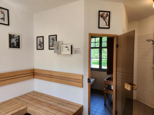 a bathroom with a bench and a shower at Grafschaft in Jüterbog