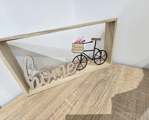 a bike in a room with a sign that readsarma at GOLDEN OASIS Free Private Parking in Ljubljana