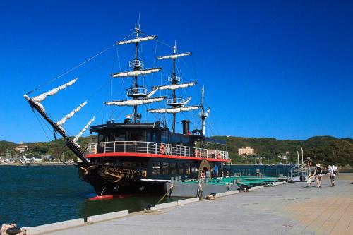 a large pirate ship docked at a dock at Ocean View Hiromi SPA Hotel温泉と絶景の宿 in Shimoda