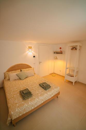 a bedroom with a bed with two pillows on it at Bitter 26 Apartment - Vinto House Collections in Nocera Superiore
