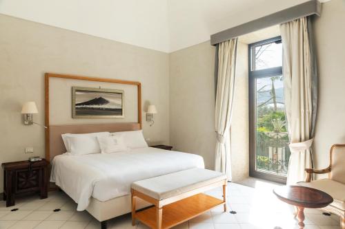 Postel nebo postele na pokoji v ubytování Grand Hotel Cocumella