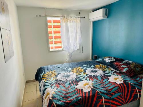 Postel nebo postele na pokoji v ubytování Appartement T3 au Moufia, Saint-Denis