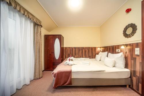 Posteľ alebo postele v izbe v ubytovaní Termál Hotel Vesta