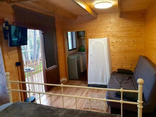 a bedroom with a bed in a log cabin at El Refugio del Valle in La Orotava