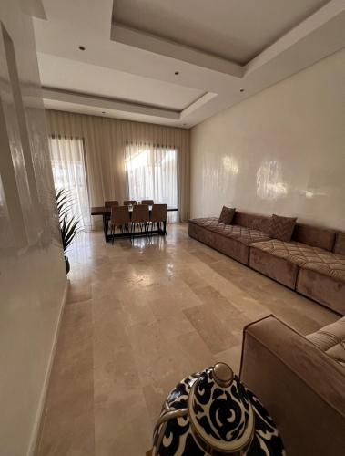 a large living room with a couch and a table at Anza Blue in Agadir