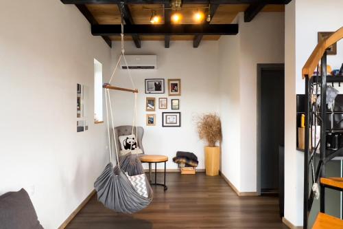 a room with a hammock hanging from the wall at HUUT in Zlatibor