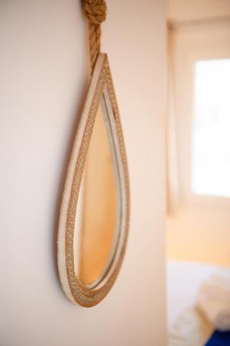a mirror hanging on a wall at Eutixia Houses - Complex of 3 deluxe studios in Vóthon