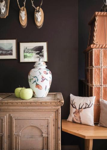a vase sitting on top of a wooden table at Christophorus Mountain Residence in San Vigilio Di Marebbe