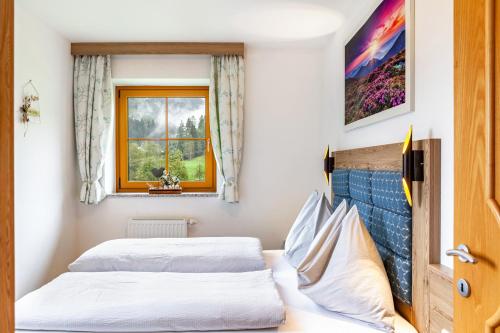 Postel nebo postele na pokoji v ubytování Ferienwohnung Haus Unterrain