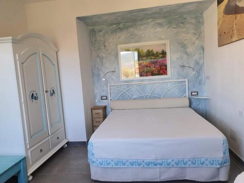 Postel nebo postele na pokoji v ubytování B&B da Nuccia Villasimius