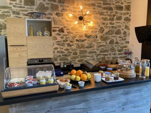a counter with a bunch of food on it at Domaine de Chabanne in Crupies