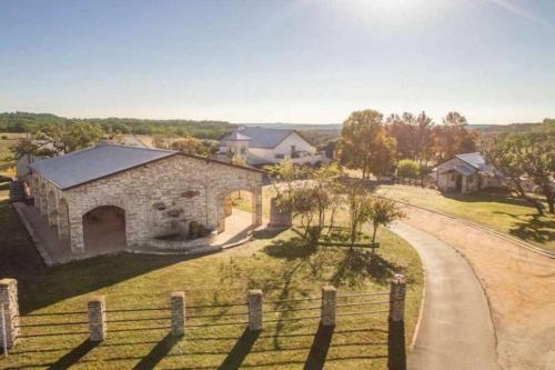 an aerial view of a stone building with a fence at Longhorn Cabin near Hidden Falls with View in Smithwick