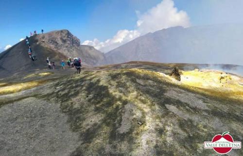 a group of people riding bikes on a hill at Agriturismo Valle dell'Etna in Roccella Valdemone