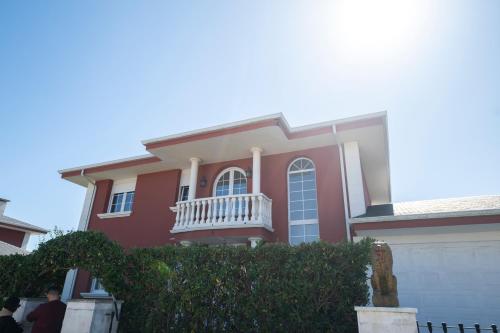 a man standing in front of a house at Chalet grande en Soto de la Marina in Liencres