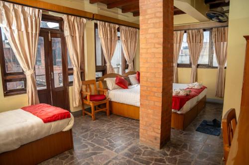 Postel nebo postele na pokoji v ubytování Golden Gate Guest House