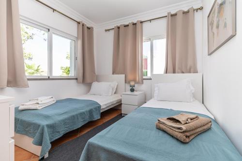 Ένα ή περισσότερα κρεβάτια σε δωμάτιο στο Tavira Casa Jenny