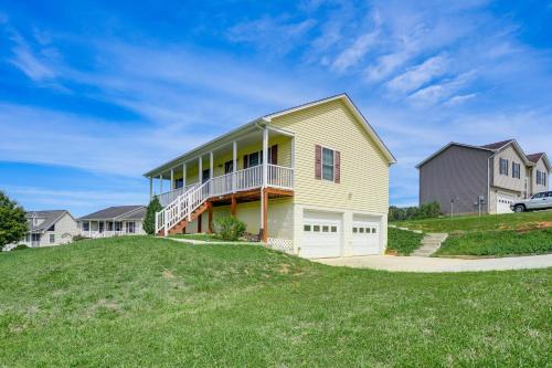 a house on a hill with green grass at Charming Shenandoah Retreat with Deck! in Shenandoah