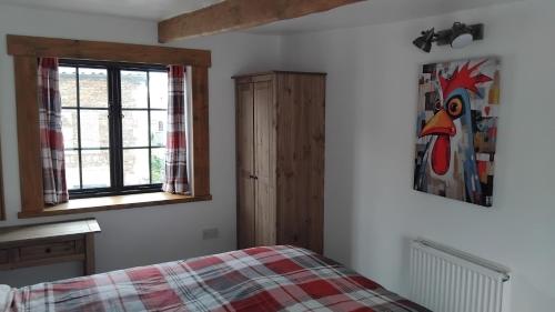 a bedroom with a bed and a window at St Edmunds Brewery in Downham Market
