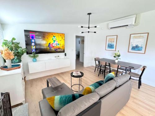 a living room with a couch and a table at Disneyland Retreat-Pool Spa Game in Anaheim