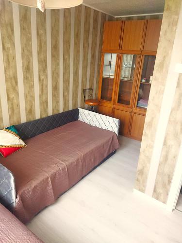 a bedroom with a bed in a room at Itaja apartment 49 in Šiauliai