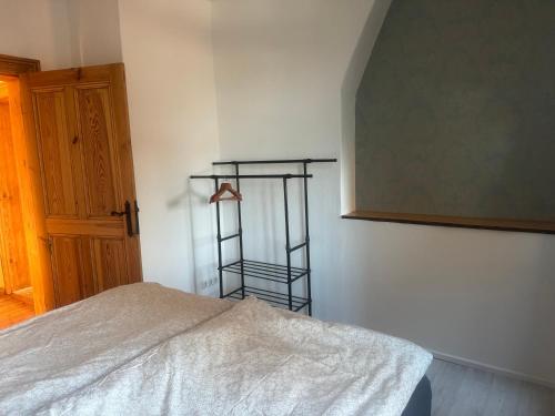 Postel nebo postele na pokoji v ubytování Kaminzimmer