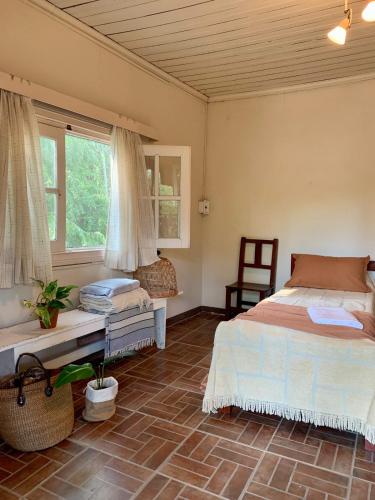 a bedroom with two beds and a window at Casa al rio - Malen in Tigre