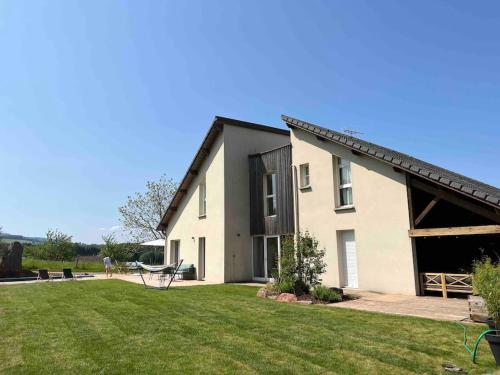 a large white house with a large yard at LA MAISON DES VOSGES Nature & Pool in Senones