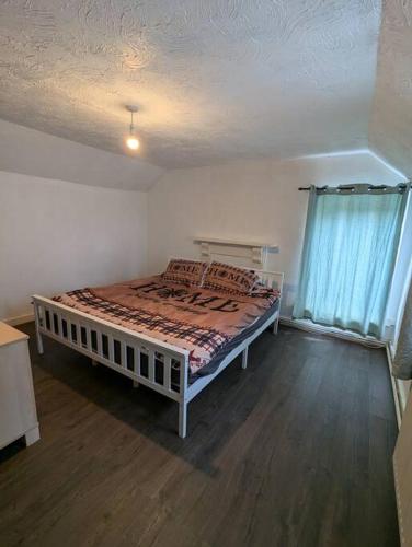 a bedroom with a bed in a room at The Lodge - Built in the 1850s in Clydach
