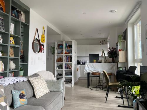 a living room with a couch and a table at Cozy Flat with Stunning Views in London
