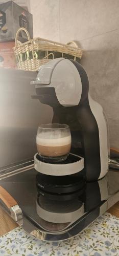 a black and white coffee maker sitting on a table at Ferrara1 in Ferrara