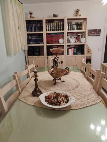 a dining room table with a plate of food on it at Agalia house in Néon Roinón