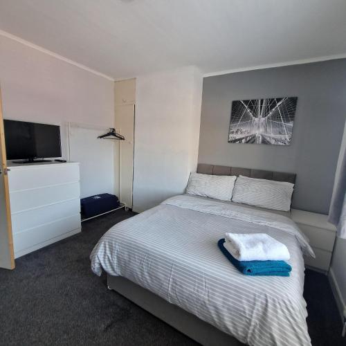 Ένα ή περισσότερα κρεβάτια σε δωμάτιο στο Belfast City house