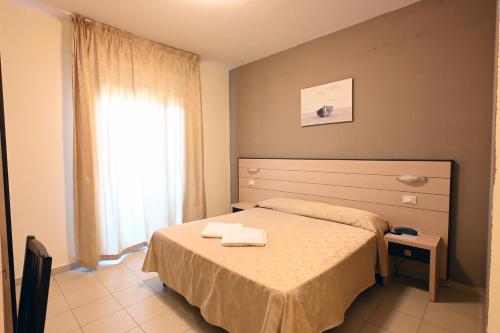 Postel nebo postele na pokoji v ubytování Hotel Paradiso Verde