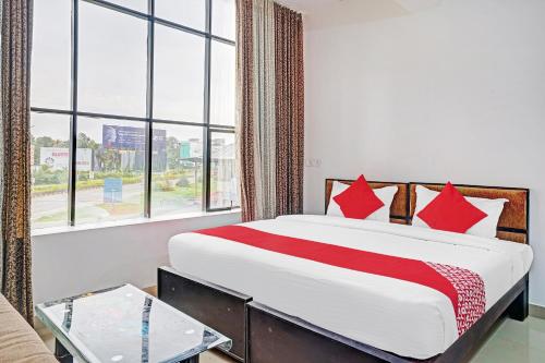 Ένα ή περισσότερα κρεβάτια σε δωμάτιο στο Hotel O Thaza
