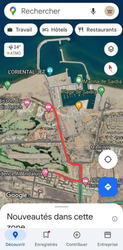 a screenshot of a cell phone with a map at Appartement entier avec parking privé AP4 Saidia in Cherarba