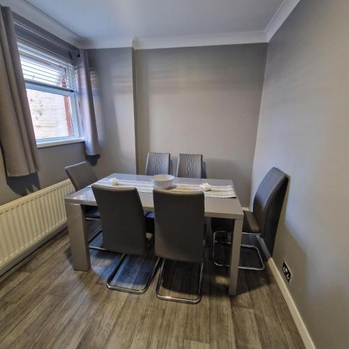a conference room with a table and chairs at Belfast City house in Belfast