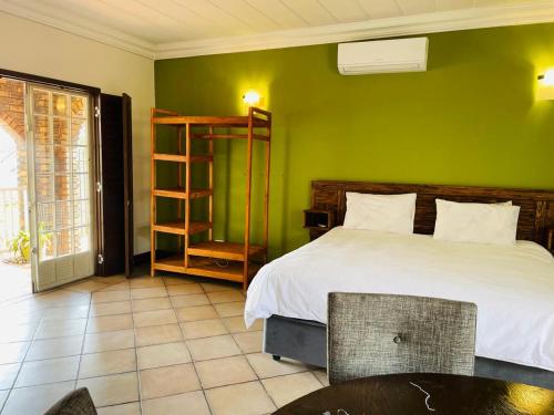 Katil atau katil-katil dalam bilik di Melodie Guest House