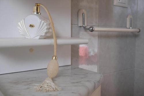 a kitchen sink with a spoon on a counter at Casa degli Artisti in Burano