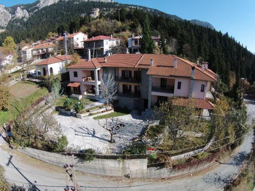an aerial view of a house on a mountain at Hotel Kroupi in Elati Trikalon
