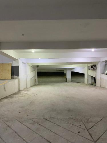 an empty parking lot in an empty parking garage at Cozy Modern 1BR Apt in Lavington Kilimani in Nairobi