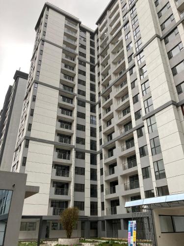 a large apartment building with balconies at Cozy Modern 1BR Apt in Lavington Kilimani in Nairobi