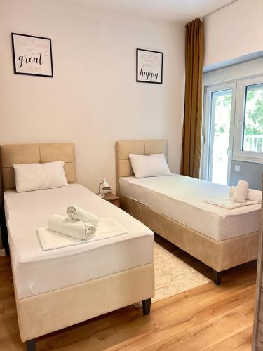 two beds sitting next to each other in a room at Apartment Stone Mostar in Mostar