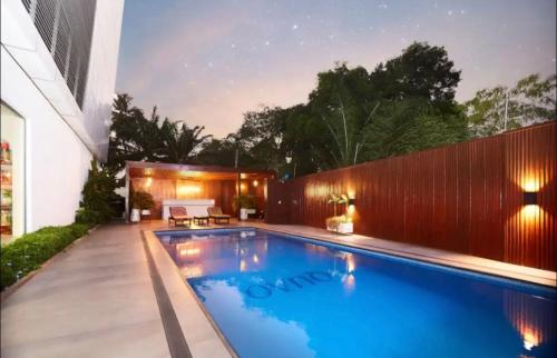 a swimming pool in the backyard of a house at 233 Boulevard - Luxury Apartment in Accra