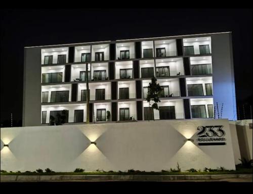 a large building with lights in front of it at 233 Boulevard - Luxury Apartment in Accra