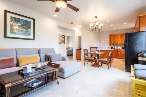 a living room with a couch and a table at Hilo Manu Iki Ohana in Hilo
