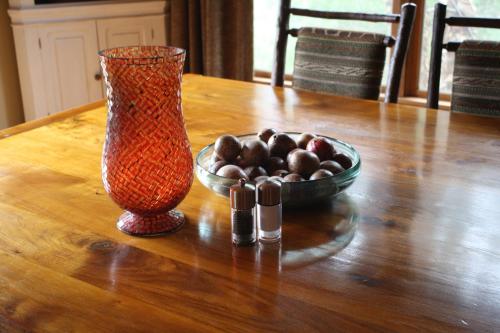 a vase and a bowl of rocks on a table at Heaven's Gate in Ellijay