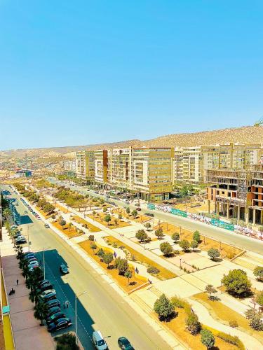 a view of a city with buildings and a street at Family Home in Agadir