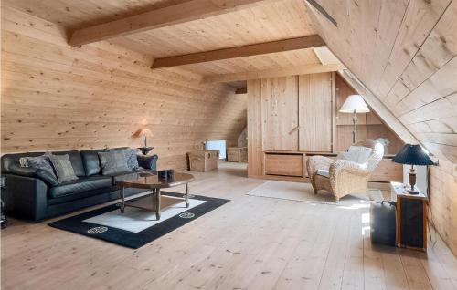 a living room with a couch and a table at Drostgården in Humble