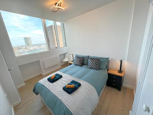 a bedroom with a bed with two pillows on it at City Centre - Sleeps 4 & Free Parking in Birmingham